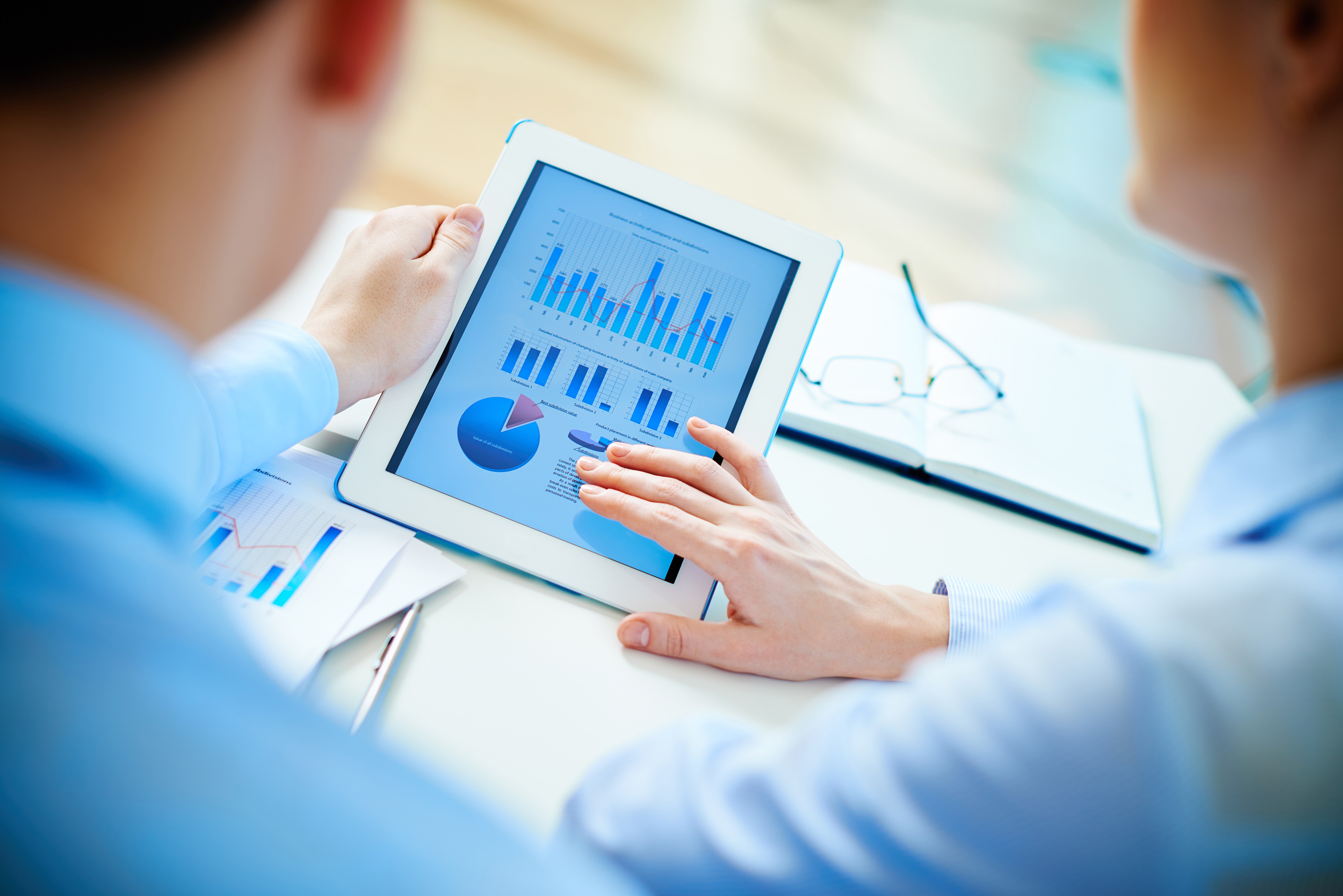 executives-checking-diagrams-with-touchpad